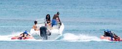 th_208033849_RihannaenjoysafunridewithfriendsonaboatinBarbados_41_122_513lo.jpg