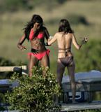 Naomi Campbell in red bikinis