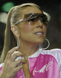 Mariah Carey shows legs in short jeans shorts and peek of cleavage wearing unzipped jacket as she throws the ceremonial first pitch before Japanese professional baseball match at Tokyo Dome in Tokyo